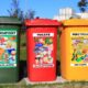 Waste boxes with posters showing principles of waste management and segregating waste according to plastic presence.